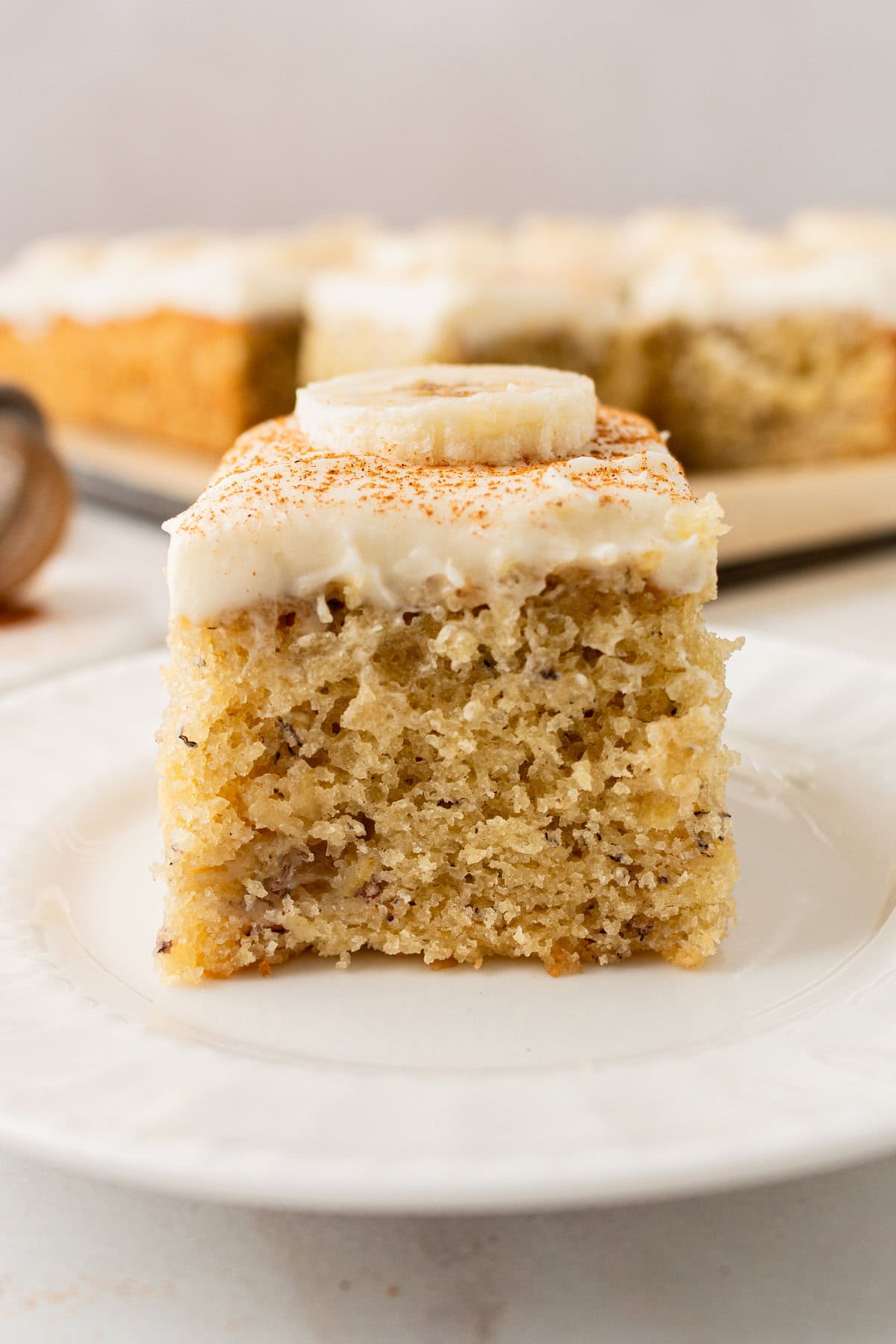 Jeff's BEST Banana Cake Recipe is a moist and tender banana cake with a creamy, sweet, and buttery cream cheese frosting. Some say it is the best banana cake in the world! This moist banana cake with cream cheese frosting is baked in a 9×13 pan and is always a hit!