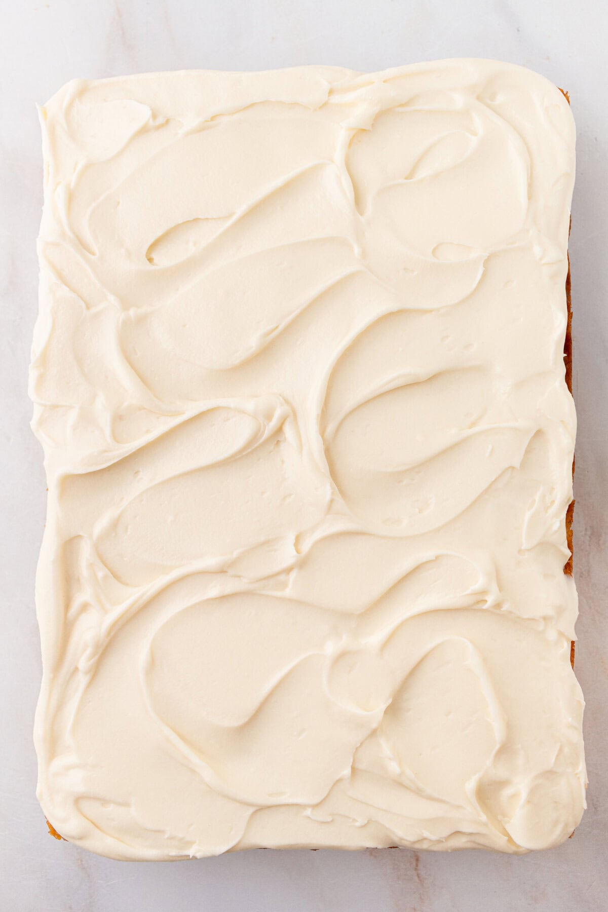 Banana Cake in 9x13 pan with cream cheese frosting.