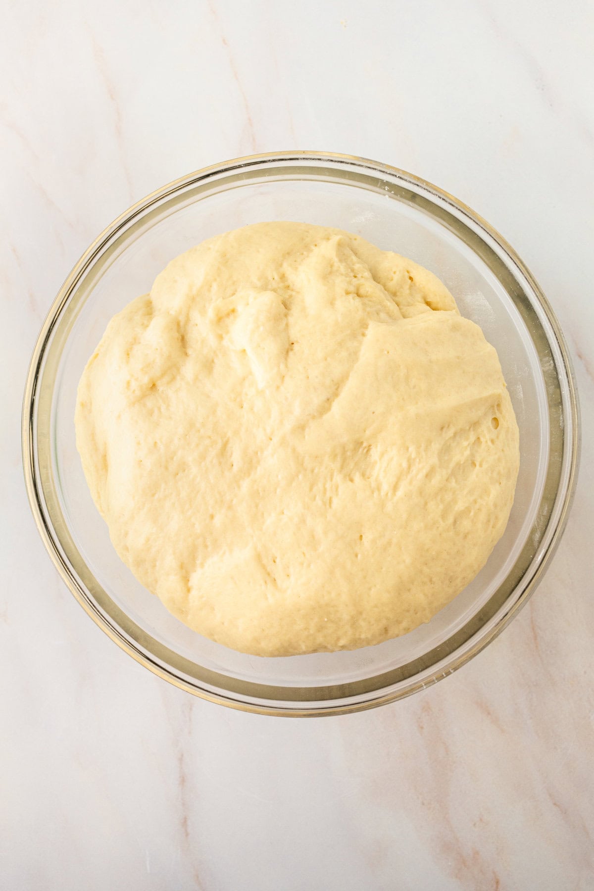 Cinnamon roll dough rising after second rise and doubled in size.