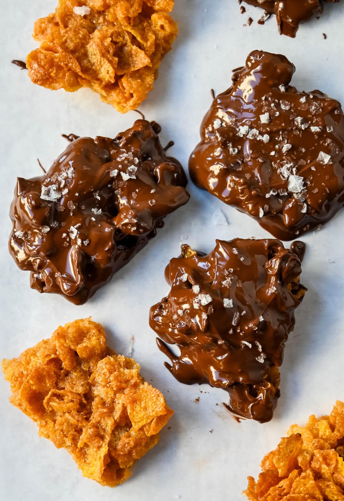 Cornflake Crack is a super easy treat made with only three ingredients -- cornflakes cereal, butter, and brown sugar—this quick treat bakes into a caramelized layer of goodness that’s perfect on its own or even better when dipped in melted chocolate. This can also be called Cornflake Crunch or Cornflake Candy or Chocolate Covered Cornflake Crack.