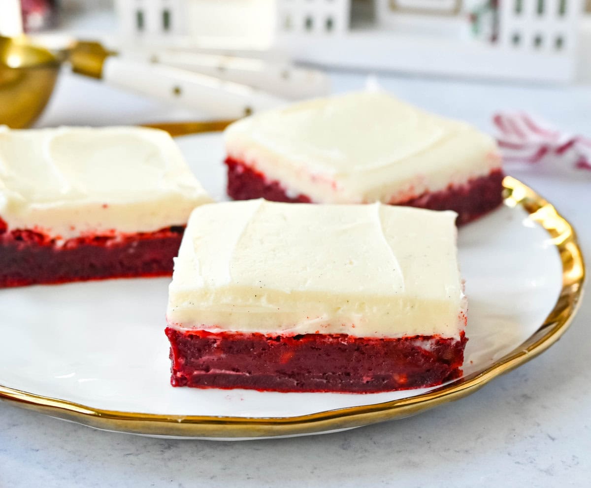 Red velvet brownies are a decadent twist on the classic red velvet cake, combining the color, subtle cocoa flavor, and creamy texture into the perfect brownies. These homemade Red Velvet Brownies with a sweet cream cheese frosting are fudgy and rich with a tangy and sweet cream cheese frosting. 