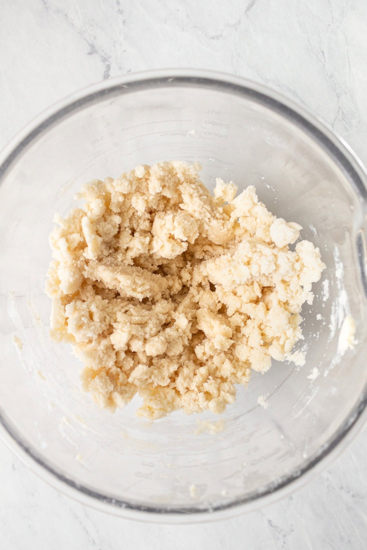 Mixing butter and dry ingredients together in homemade yellow cake recipe