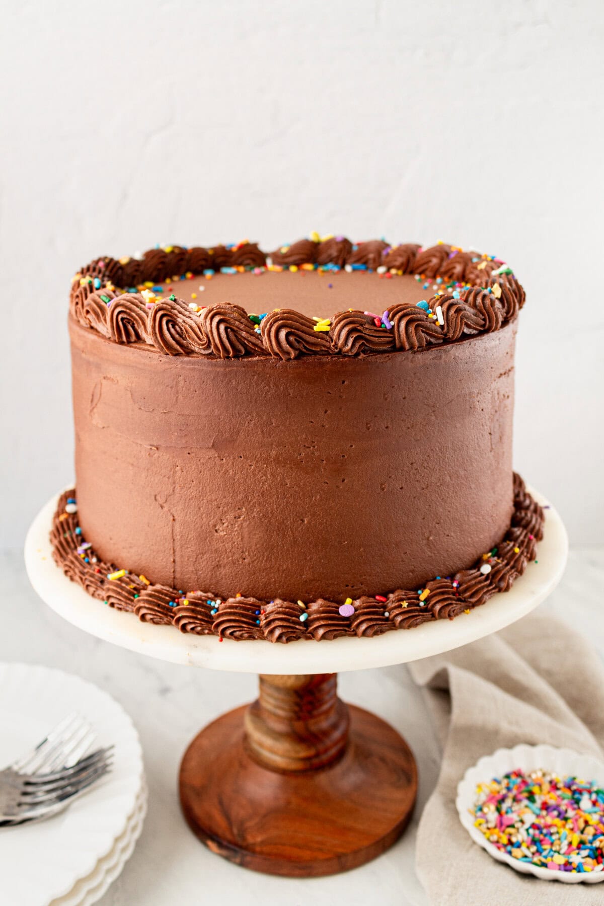 The BEST Yellow Cake Recipe with Milk Chocolate Frosting. 5-Star Rated Recipe! This golden, tender yellow cake is topped with a thick layer of creamy chocolate frosting. Thanks to a secret ingredient -- this homemade yellow cake bakes up moist, fluffy, and full of flavor every time. If you are celebrating a birthday, make sure to request this Yellow Birthday Cake with Chocolate Frosting!