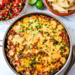 This Cheesy Taco Rice Skillet is a hearty, one-pan meal that brings all your favorite Tex-Mex flavors together in under 30 minutes. This Mexican Taco Skillet is loaded with seasoned ground beef, uncooked rice, and diced tomatoes—then simmered in a savory blend of beef broth and spices until perfectly tender and topped with melted cheese. A total crowd-pleaser for families and busy weeknights.