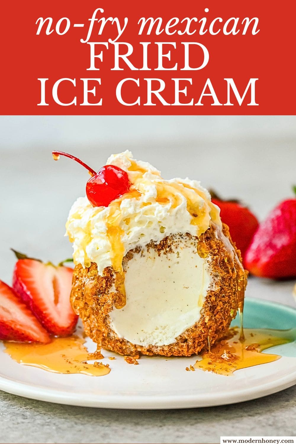 Crunchy cinnamon-sugar corn flakes coat creamy scoops of ice cream, topped with honey, whipped cream, and strawberries. This No-Fry Fried Ice Cream has zero deep-frying involved. This easy fried ice cream recipe uses corn flakes coated in buttery cinnamon sugar to mimic the crunch of a fried shell. No hot oil, no mess — just roll, freeze, and serve.