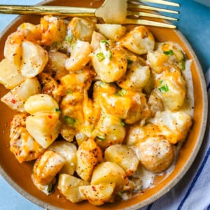 Perfect for family dinners or holiday tables, these creamy potatoes are savory, rich, and the perfect comfort food. These Kerry's Special Potatoes start with buttery, creamy yukon gold potatoes, and topped with seasoned salt and pepper, heavy cream, cheddar cheese, and sprinkled with green onions. You only need 6 ingredients to make these special potatoes.
