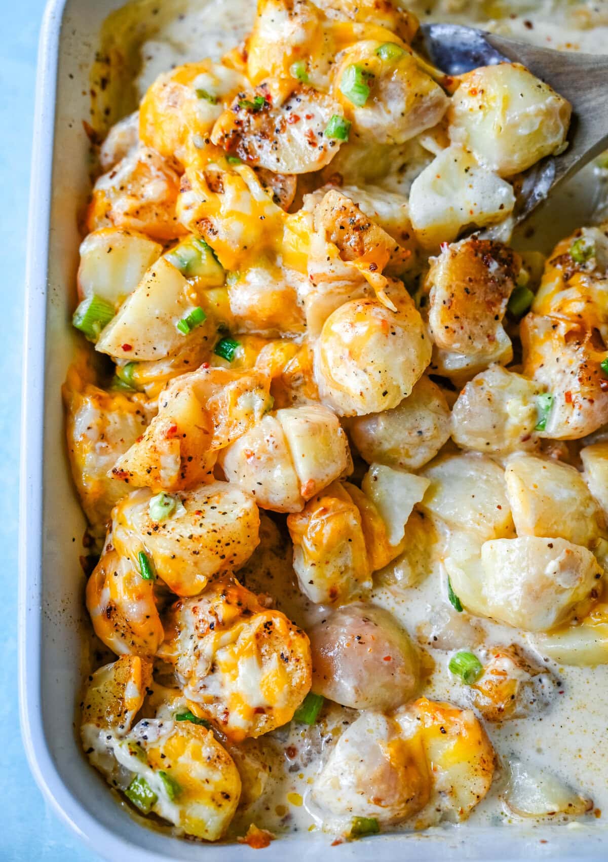 Perfect for family dinners or holiday tables, these creamy potatoes are savory, rich, and the perfect comfort food. These Kerry's Special Potatoes start with buttery, creamy yukon gold potatoes, and topped with seasoned salt and pepper, heavy cream, cheddar cheese, and sprinkled with green onions. You only need 6 ingredients to make these special potatoes. 
