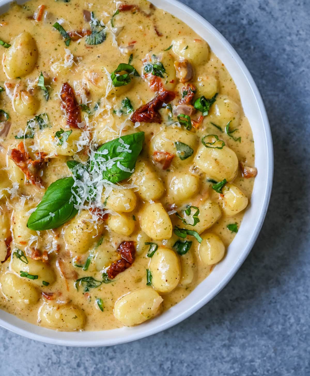 This easy Marry Me Gnocchi is made with pilowy gnocchi in a creamy sundried tomato cream sauce topped with fresh parmesan cheese and basil. Whip up this creamy Tuscan gnocchi with sun-dried tomatoes in one pan! Quick, easy, and bursting with flavor -- perfect for cozy dinners.