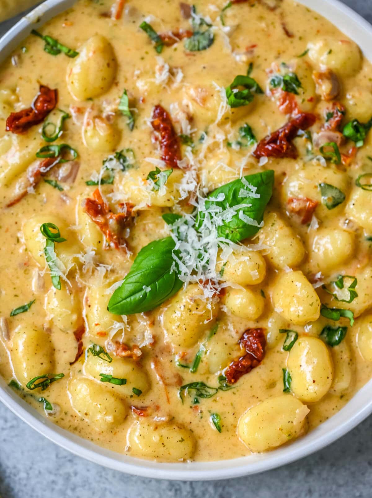 This easy Marry Me Gnocchi is made with pilowy gnocchi in a creamy sundried tomato cream sauce topped with fresh parmesan cheese and basil. Whip up this creamy Tuscan gnocchi with sun-dried tomatoes in one pan! Quick, easy, and bursting with flavor -- perfect for cozy dinners.