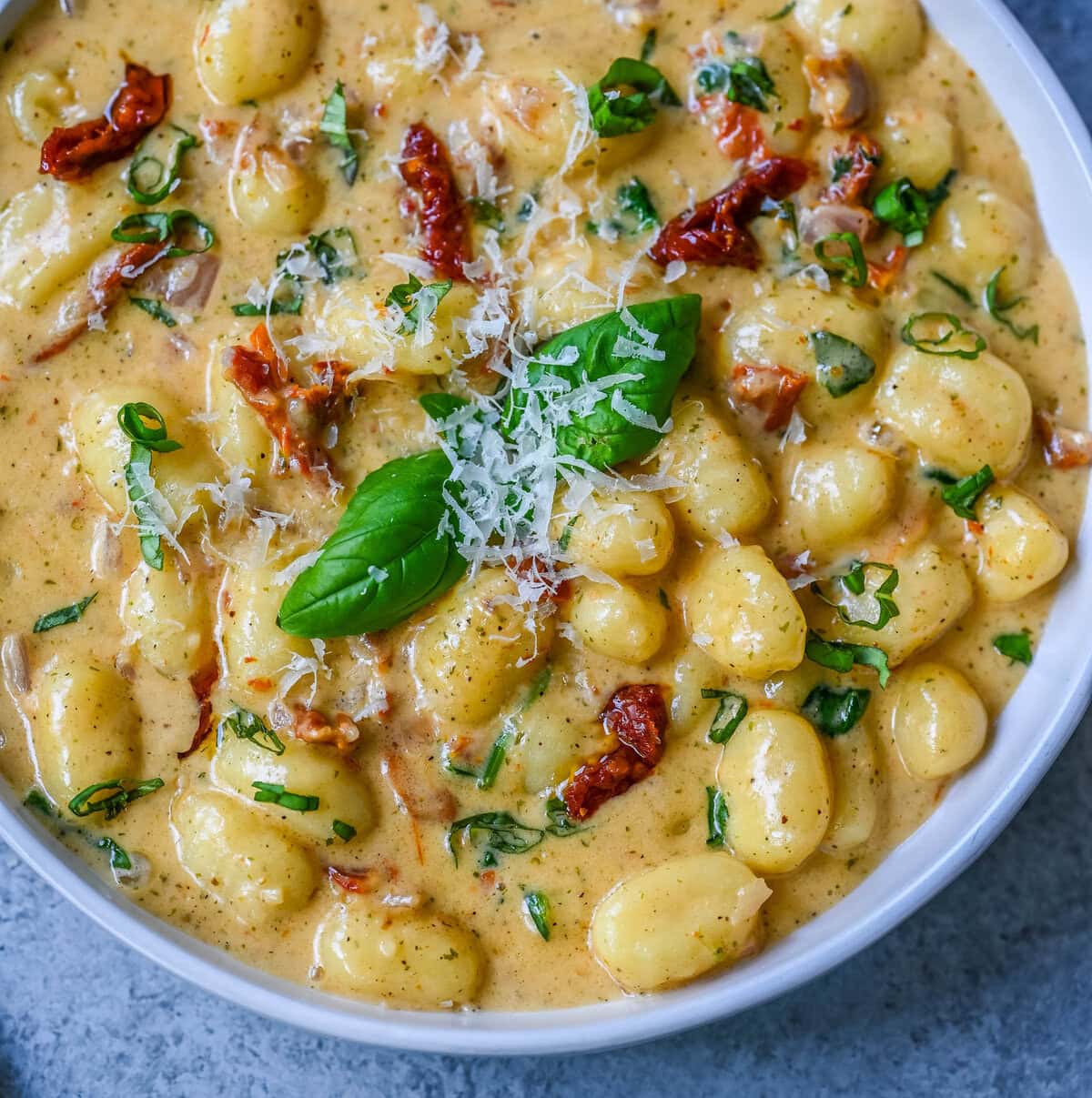 This easy Marry Me Gnocchi is made with pilowy gnocchi in a creamy sundried tomato cream sauce topped with fresh parmesan cheese and basil. Whip up this creamy Tuscan gnocchi with sun-dried tomatoes in one pan! Quick, easy, and bursting with flavor -- perfect for cozy dinners.