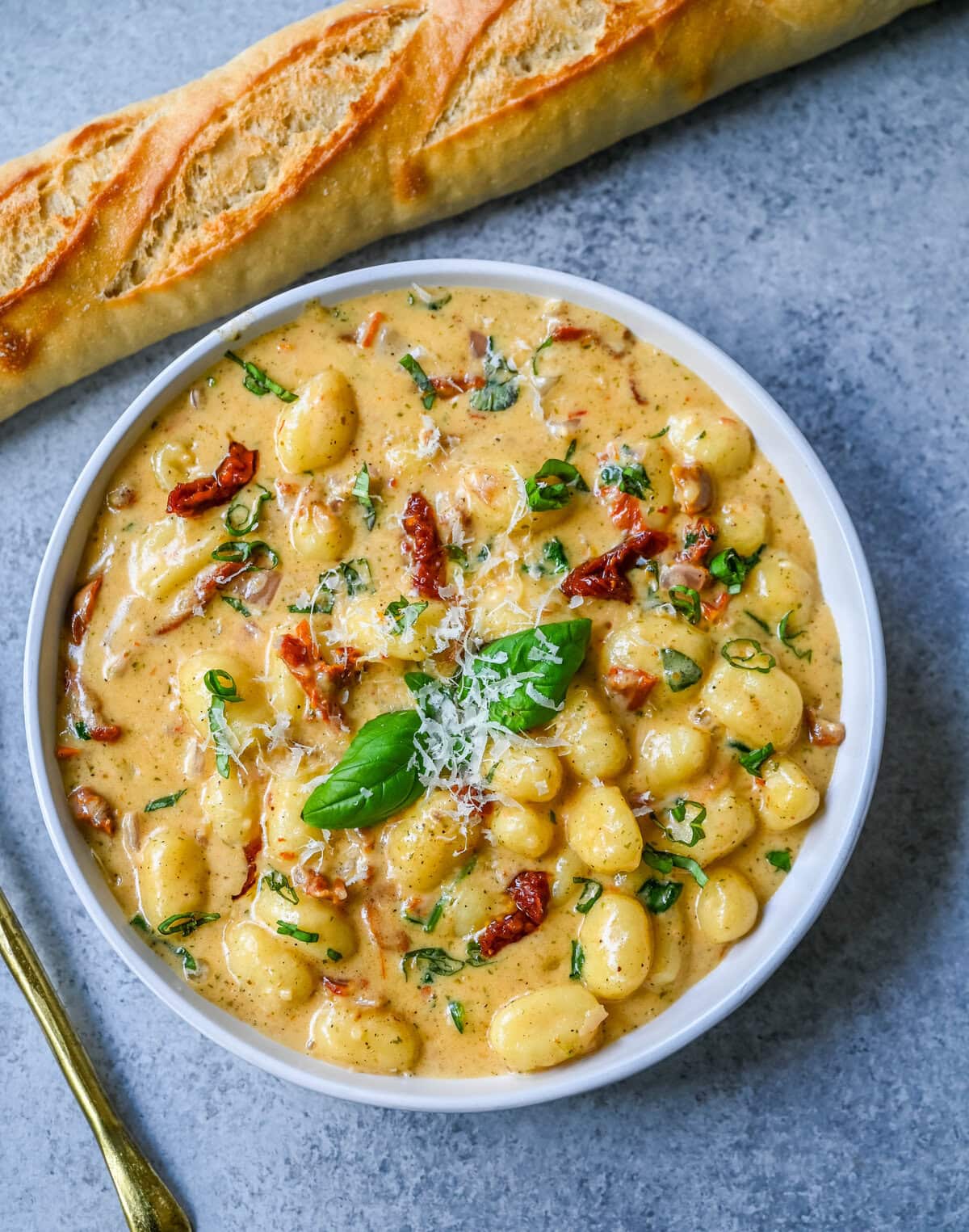 This easy Marry Me Gnocchi is made with pilowy gnocchi in a creamy sundried tomato cream sauce topped with fresh parmesan cheese and basil. Whip up this creamy Tuscan gnocchi with sun-dried tomatoes in one pan! Quick, easy, and bursting with flavor -- perfect for cozy dinners.
