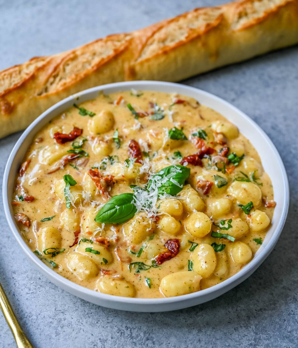 This easy Marry Me Gnocchi is made with pilowy gnocchi in a creamy sundried tomato cream sauce topped with fresh parmesan cheese and basil. Whip up this creamy Tuscan gnocchi with sun-dried tomatoes in one pan! Quick, easy, and bursting with flavor -- perfect for cozy dinners.