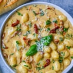 This easy Marry Me Gnocchi is made with pilowy gnocchi in a creamy sundried tomato cream sauce topped with fresh parmesan cheese and basil. Whip up this creamy Tuscan gnocchi with sun-dried tomatoes in one pan! Quick, easy, and bursting with flavor -- perfect for cozy dinners.
