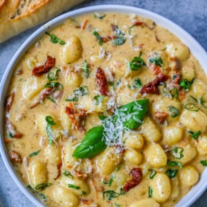 This easy Marry Me Gnocchi is made with pilowy gnocchi in a creamy sundried tomato cream sauce topped with fresh parmesan cheese and basil. Whip up this creamy Tuscan gnocchi with sun-dried tomatoes in one pan! Quick, easy, and bursting with flavor -- perfect for cozy dinners.