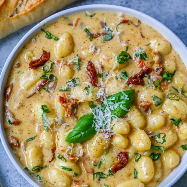 This easy Marry Me Gnocchi is made with pilowy gnocchi in a creamy sundried tomato cream sauce topped with fresh parmesan cheese and basil. Whip up this creamy Tuscan gnocchi with sun-dried tomatoes in one pan! Quick, easy, and bursting with flavor -- perfect for cozy dinners.