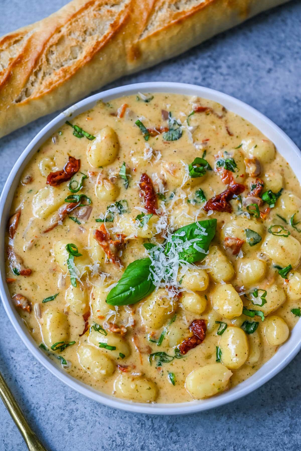 This easy Marry Me Gnocchi is made with pilowy gnocchi in a creamy sundried tomato cream sauce topped with fresh parmesan cheese and basil. Whip up this creamy Tuscan gnocchi with sun-dried tomatoes in one pan! Quick, easy, and bursting with flavor -- perfect for cozy dinners.