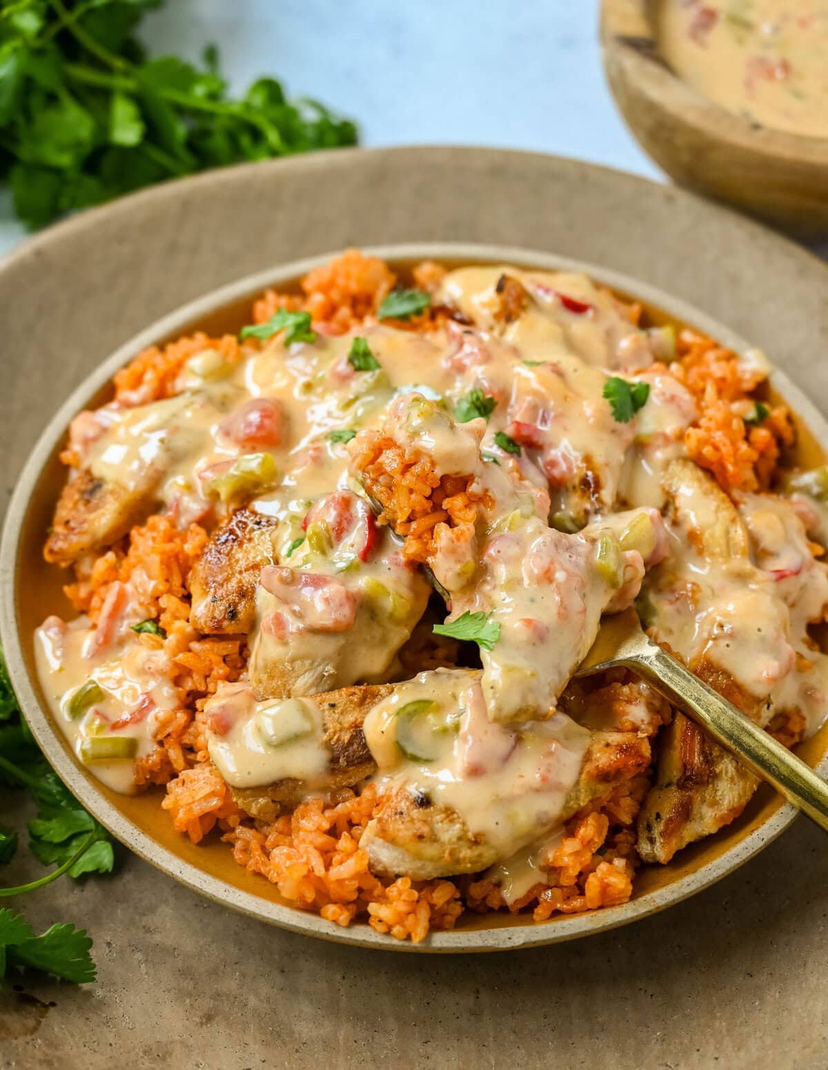 This Queso Smothered Chicken is a comforting, flavor-packed meal that makes everyone at the table ask for seconds — Pollo con Queso is it. This dish brings together juicy sautéed chicken, homemade Spanish rice, and a rich, creamy queso sauce made from scratch.  A hearty, cheesy, restaurant-style dish you can make right at home — and better than takeout.