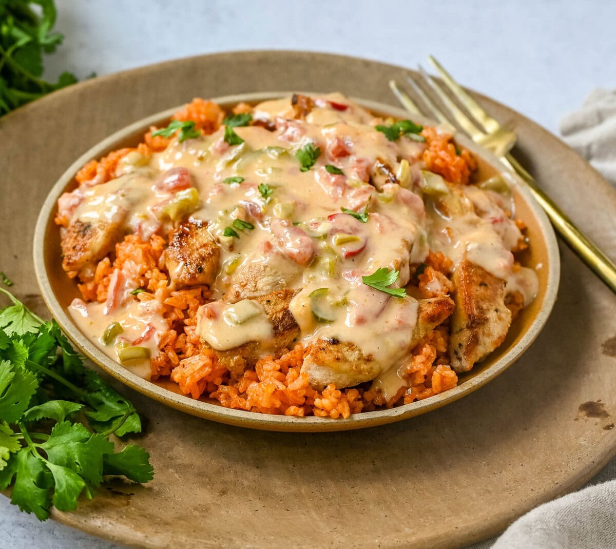 This Queso Smothered Chicken is a comforting, flavor-packed meal that makes everyone at the table ask for seconds — Pollo con Queso is it. This dish brings together juicy sautéed chicken, homemade Spanish rice, and a rich, creamy queso sauce made from scratch.  A hearty, cheesy, restaurant-style dish you can make right at home — and better than takeout.