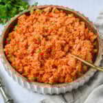 This easy Spanish Rice Recipe — also known as Mexican rice — is a flavorful, vibrant side dish made with sautéed onions, long-grain rice, Mexican spices, and fresh tomato sauce. This is the best Spanish rice recipe and is so easy to make!