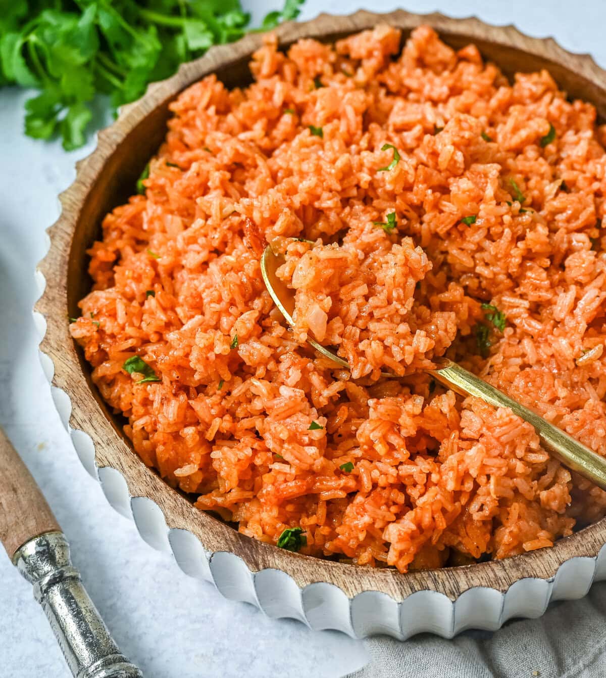 This easy Spanish Rice Recipe — also known as Mexican rice — is a flavorful, vibrant side dish made with sautéed onions, long-grain rice, Mexican spices, and fresh tomato sauce. This is the best Spanish rice recipe and is so easy to make!