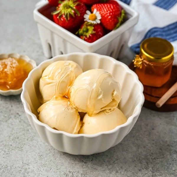 This homemade honey ice cream recipe features a rich, creamy texture with the natural sweetness of real honey and no added refined sugars. This is such a nourishing ice cream recipe with dried milk powder and egg yolks for extra protein and rich custard flavor. This Walt's Dream Ice cream is healthier version of homemade ice cream!