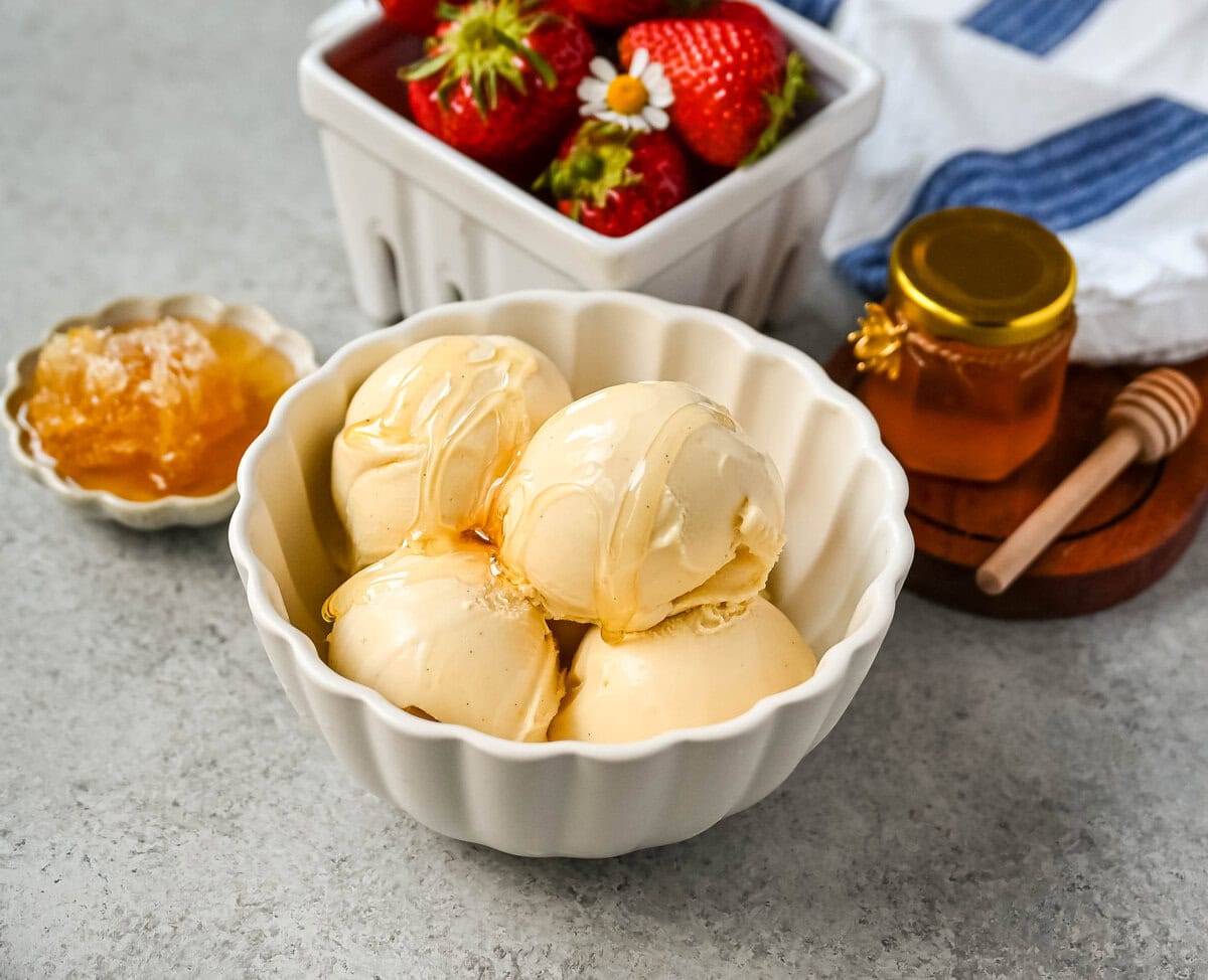 This homemade honey ice cream recipe features a rich, creamy texture with the natural sweetness of real honey and no added refined sugars. This is such a nourishing ice cream recipe with dried milk powder and egg yolks for extra protein and rich custard flavor. This Walt's Dream Ice cream is healthier version of homemade ice cream!