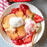 This warm, bubbling strawberry cobbler is everything summer should taste like...sweet, juicy berries tucked under a golden, buttery crust. Top it with vanilla ice cream and watch it disappear.