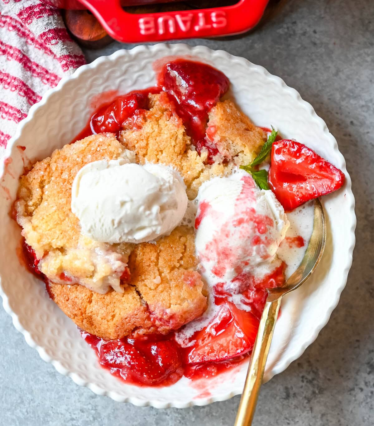 This warm, bubbling strawberry cobbler is everything summer should taste like...sweet, juicy berries tucked under a golden, buttery crust. Top it with vanilla ice cream and watch it disappear.