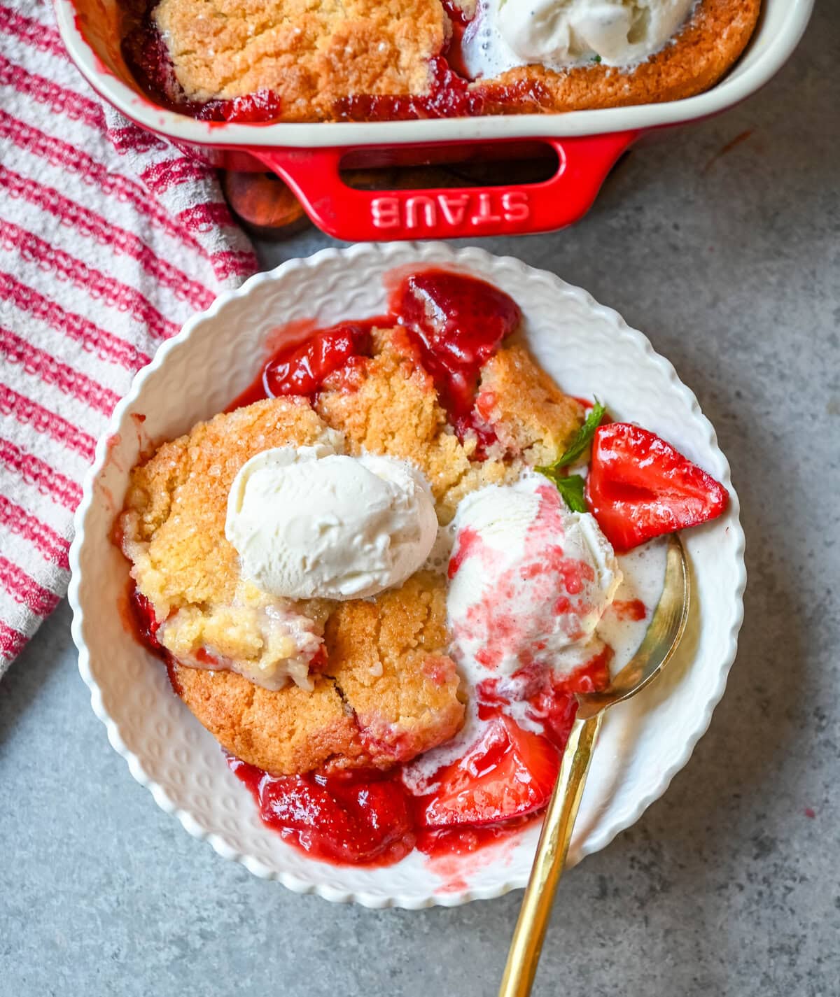 This warm, bubbling strawberry cobbler is everything summer should taste like...sweet, juicy berries tucked under a golden, buttery crust. Top it with vanilla ice cream and watch it disappear.