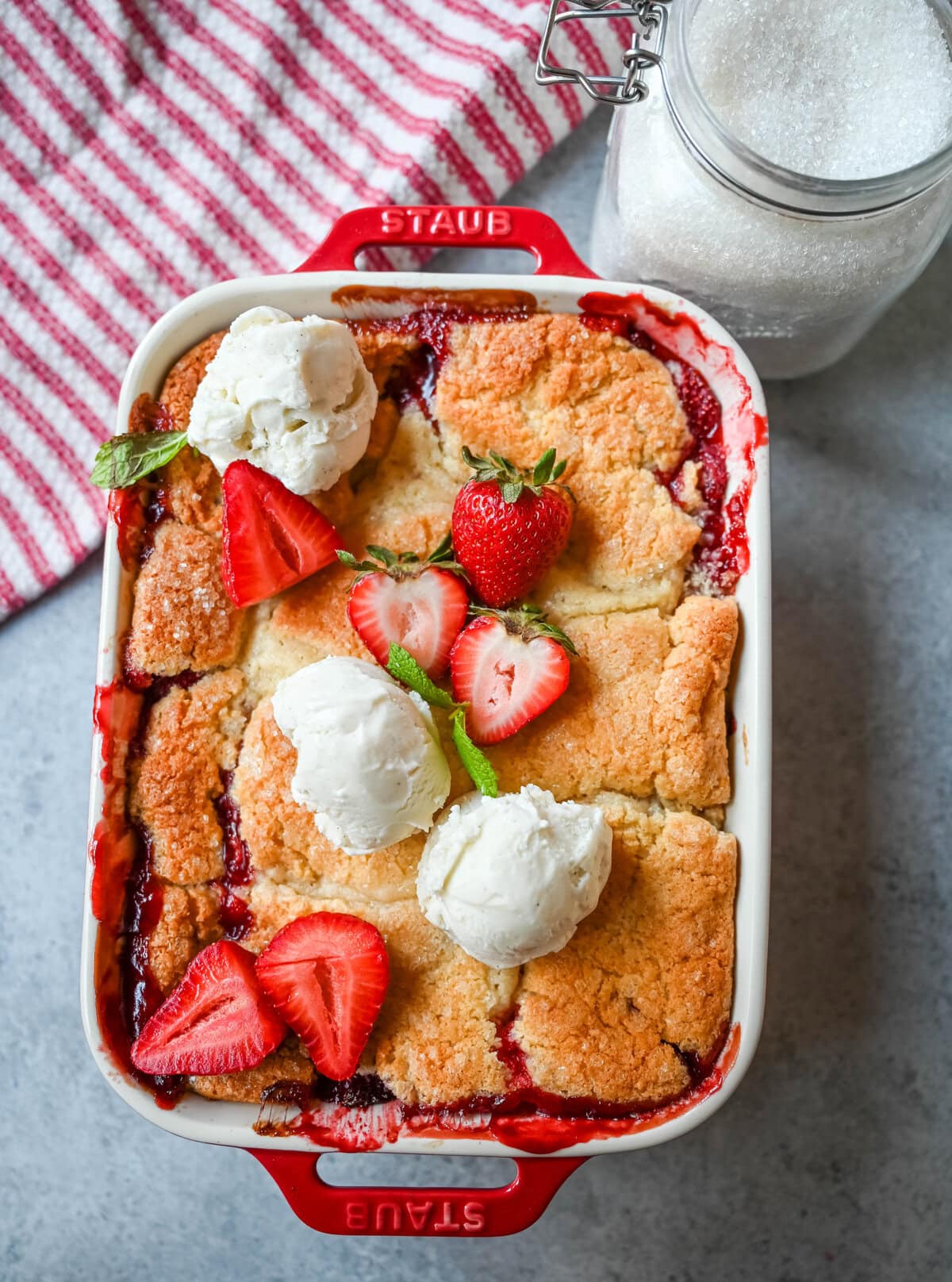 This warm, bubbling strawberry cobbler is everything summer should taste like...sweet, juicy berries tucked under a golden, buttery crust. Top it with vanilla ice cream and watch it disappear.