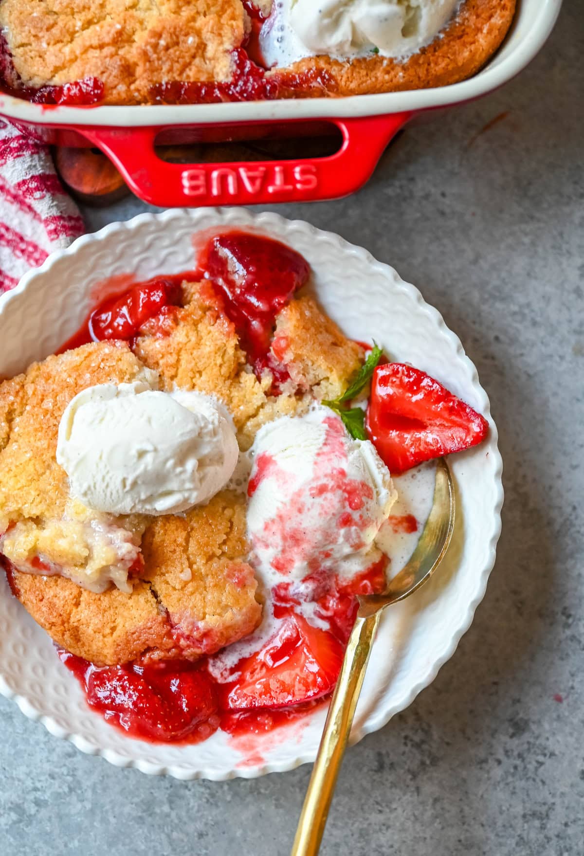 This warm, bubbling strawberry cobbler is everything summer should taste like...sweet, juicy berries tucked under a golden, buttery crust. Top it with vanilla ice cream and watch it disappear.