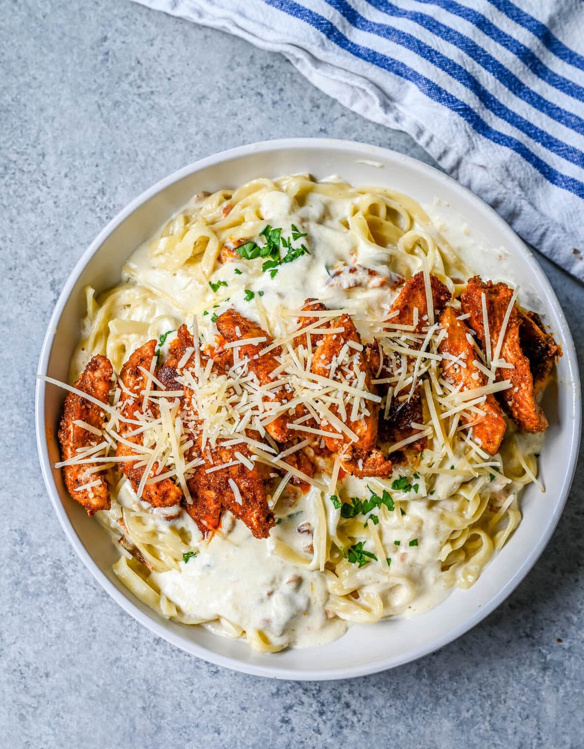 Cajun Chicken Alfredo is the ultimate comfort food with a spicy twist — tender blackened chicken, tossed in a silky Parmesan cream sauce over perfectly cooked pasta. Whether you're cooking for a weeknight dinner or a crowd, this dish delivers big time in flavor.