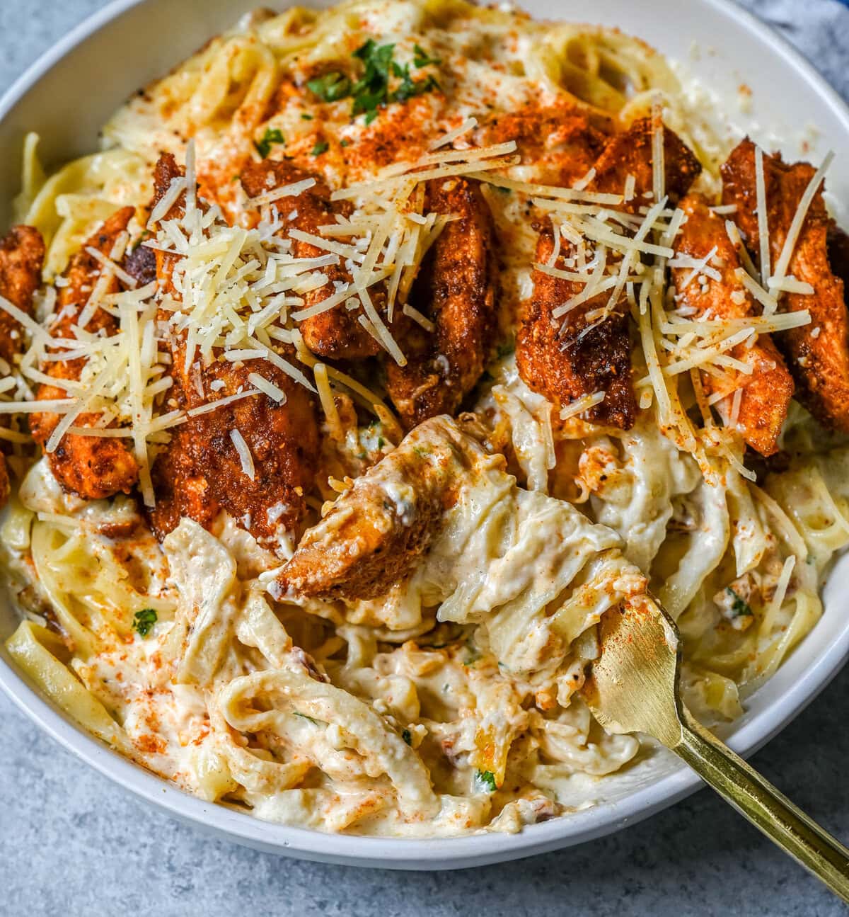 Cajun Chicken Alfredo is the ultimate comfort food with a spicy twist — tender blackened chicken, tossed in a silky Parmesan cream sauce over perfectly cooked pasta. Whether you're cooking for a weeknight dinner or a crowd, this dish delivers big time in flavor.