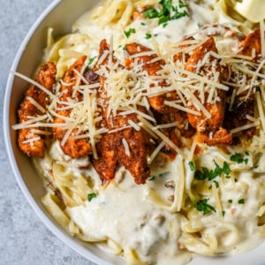 Cajun Chicken Alfredo is the ultimate comfort food with a spicy twist — tender blackened chicken, tossed in a silky Parmesan cream sauce over perfectly cooked pasta. Whether you're cooking for a weeknight dinner or a crowd, this dish delivers big time in flavor.