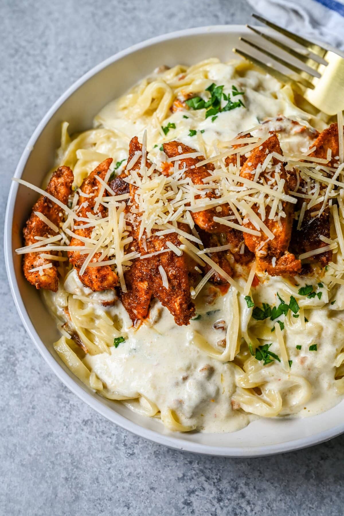 Cajun Chicken Alfredo is the ultimate comfort food with a spicy twist — tender blackened chicken, tossed in a silky Parmesan cream sauce over perfectly cooked pasta. Whether you're cooking for a weeknight dinner or a crowd, this dish delivers big time in flavor.