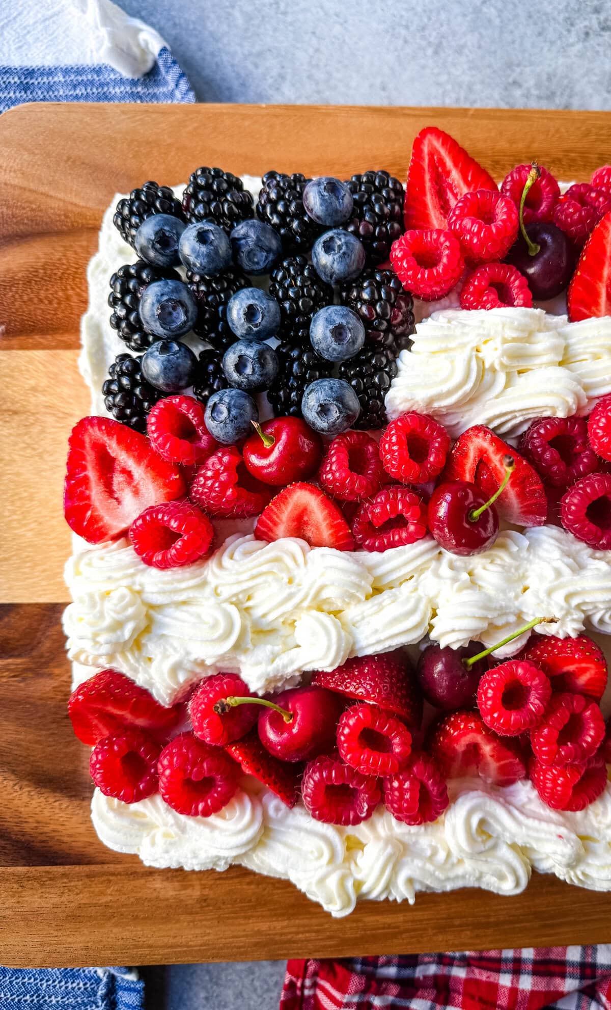 Best Flag Cake. Looking for a show-stopping, patriotic dessert that’s as delicious as it is beautiful? This American Flag Cake is your go-to recipe! It starts with a moist vanilla cake base, is topped with a lusciously light whipped cream cheese frosting, and decorated with fresh berries and cherries arranged like the U.S. flag.