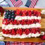 Best Flag Cake Recipe. Looking for a show-stopping, patriotic dessert that’s as delicious as it is beautiful? This American Flag Cake is your go-to recipe! It starts with a moist vanilla cake base, is topped with a lusciously light whipped cream cheese frosting, and decorated with fresh berries and cherries arranged like the U.S. flag.