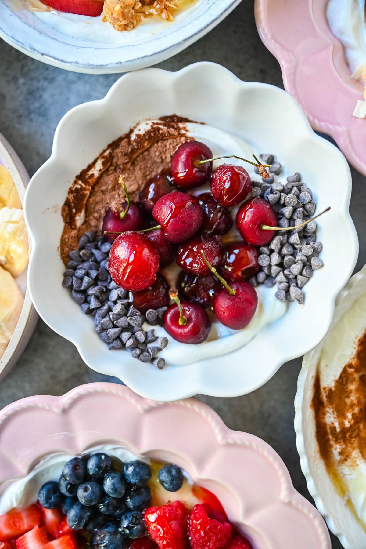 Chocolate Covered Cherry Greek Yogurt Breakfast Bowl. Greek yogurt, frozen cherries, cacao powder, mini semisweet chocolate chips.