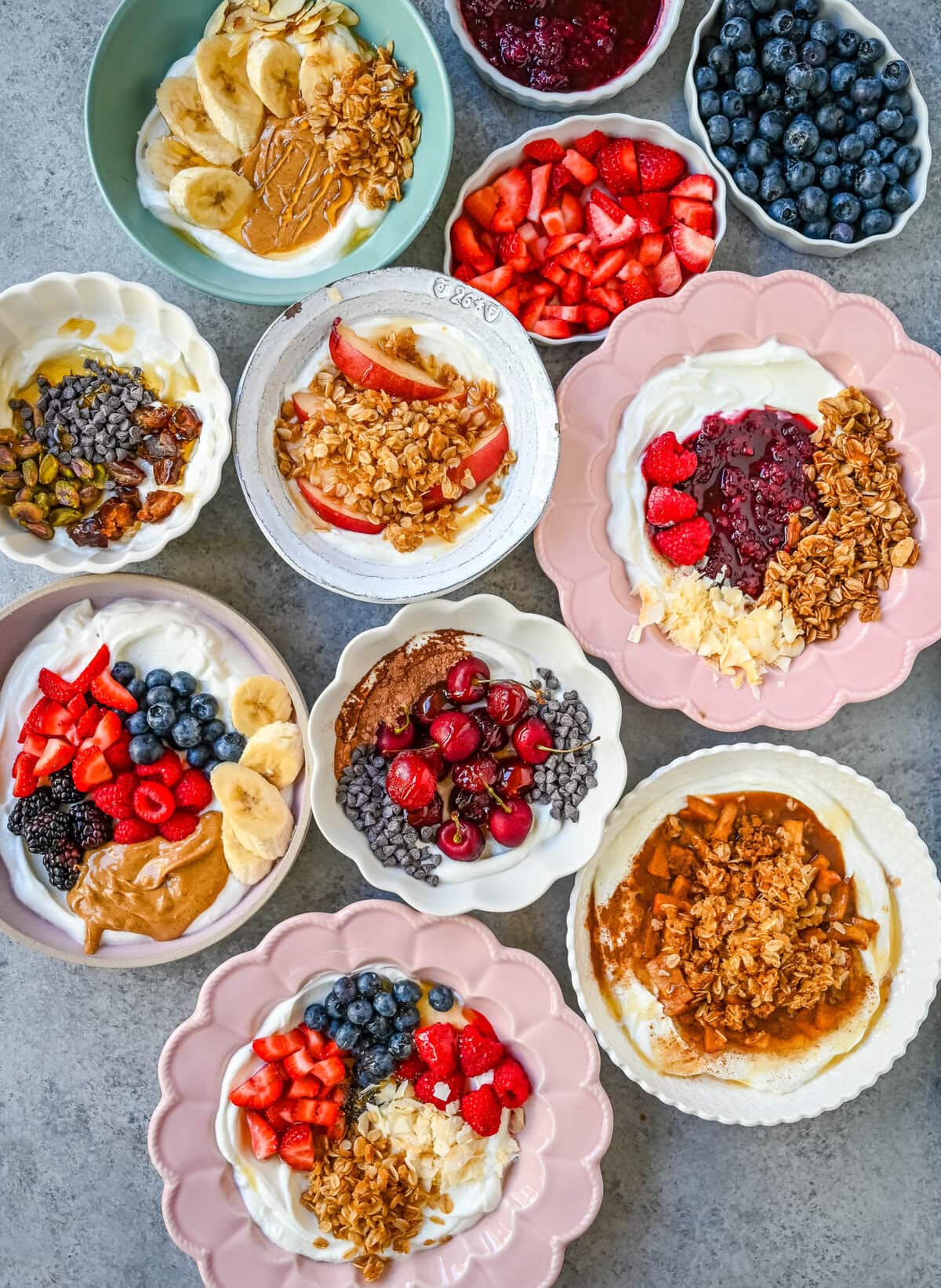 Greek Yogurt Breakfast Bowls start with rich creamy yogurt, topped with fresh fruits, nuts, granola, and superfoods for a perfect start to the day! How to make the best Greek yogurt bowls with toppings. You will find over 20+ Greek Yogurt Bowl combinations with different topping ideas for high protein yogurt bowls, what toppings pair well with greek yogurt, and recipes.