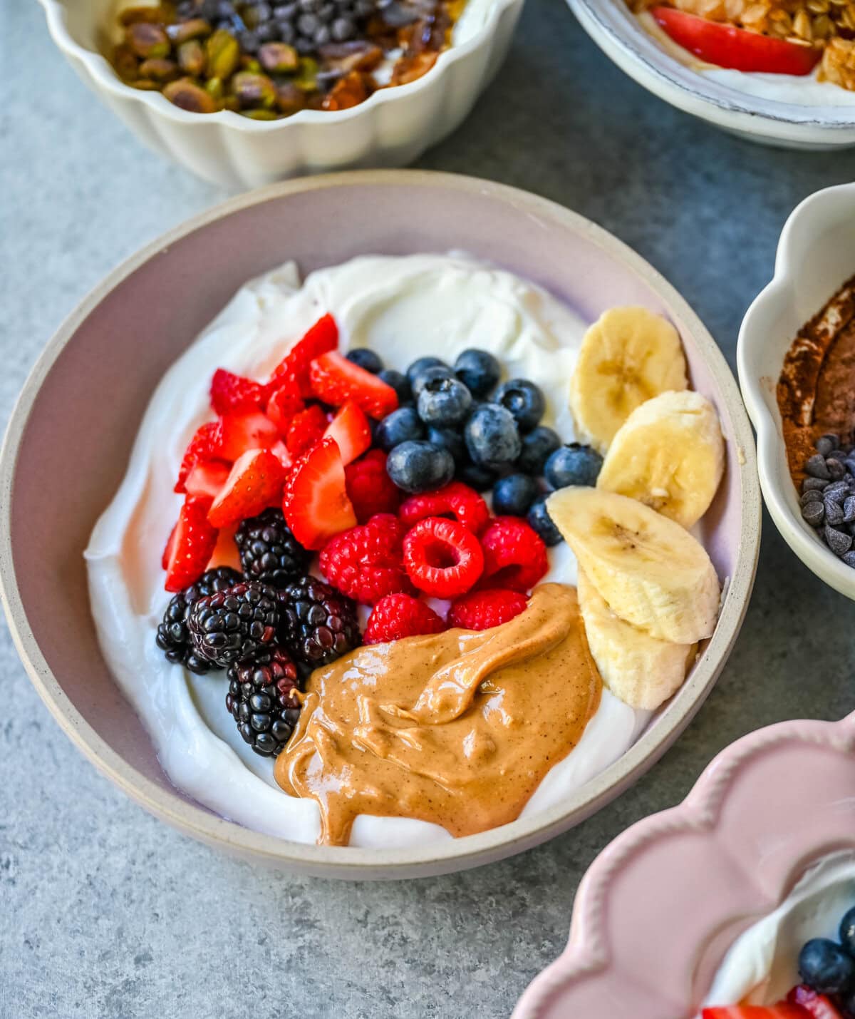 Peanut Butter Berry Yogurt Bowl. Greek yogurt, natural peanut butter, strawberries, raspberries, blackberries, blueberries, bananas.