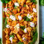 This Harissa Chicken and Roasted Potatoes recipe is a flavorful one-pan meal with juicy chicken breasts coated in a spicy harissa sauce and roasted with golden potatoes until perfectly crispy. A sprinkle of herbs at the end brings balance to this North African–inspired dish. It’s easy, satisfying, and the perfect simple weeknight dinner!