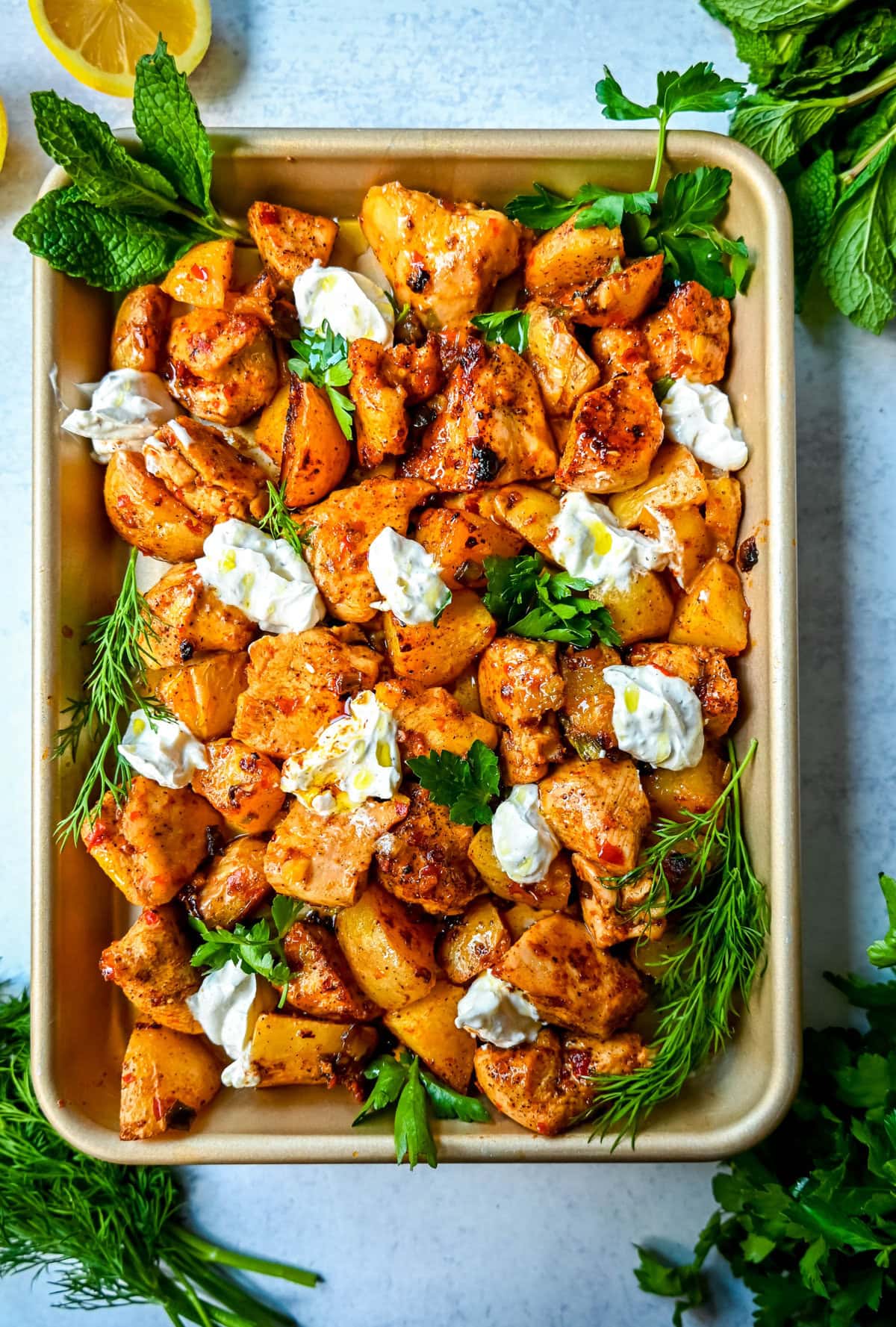This Harissa Chicken and Roasted Potatoes recipe is a flavorful one-pan meal with juicy chicken breasts coated in a spicy harissa sauce and roasted with golden potatoes until perfectly crispy. A sprinkle of herbs at the end brings balance to this North African–inspired dish. It’s easy, satisfying, and the perfect simple weeknight dinner!