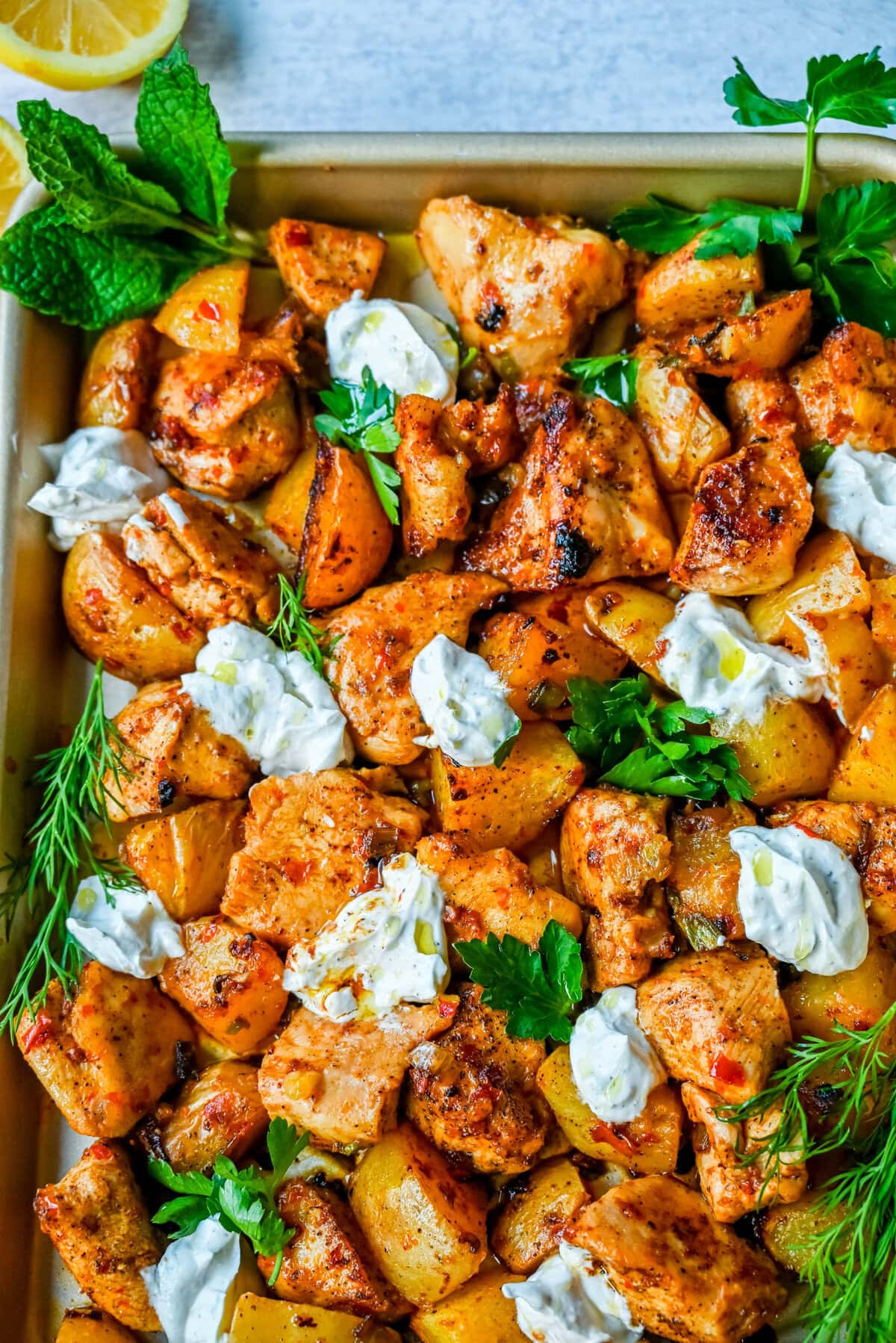 This Harissa Chicken and Roasted Potatoes recipe is a flavorful one-pan meal with juicy chicken breasts coated in a spicy harissa sauce and roasted with golden potatoes until perfectly crispy. A sprinkle of herbs at the end brings balance to this North African–inspired dish. It’s easy, satisfying, and the perfect simple weeknight dinner!