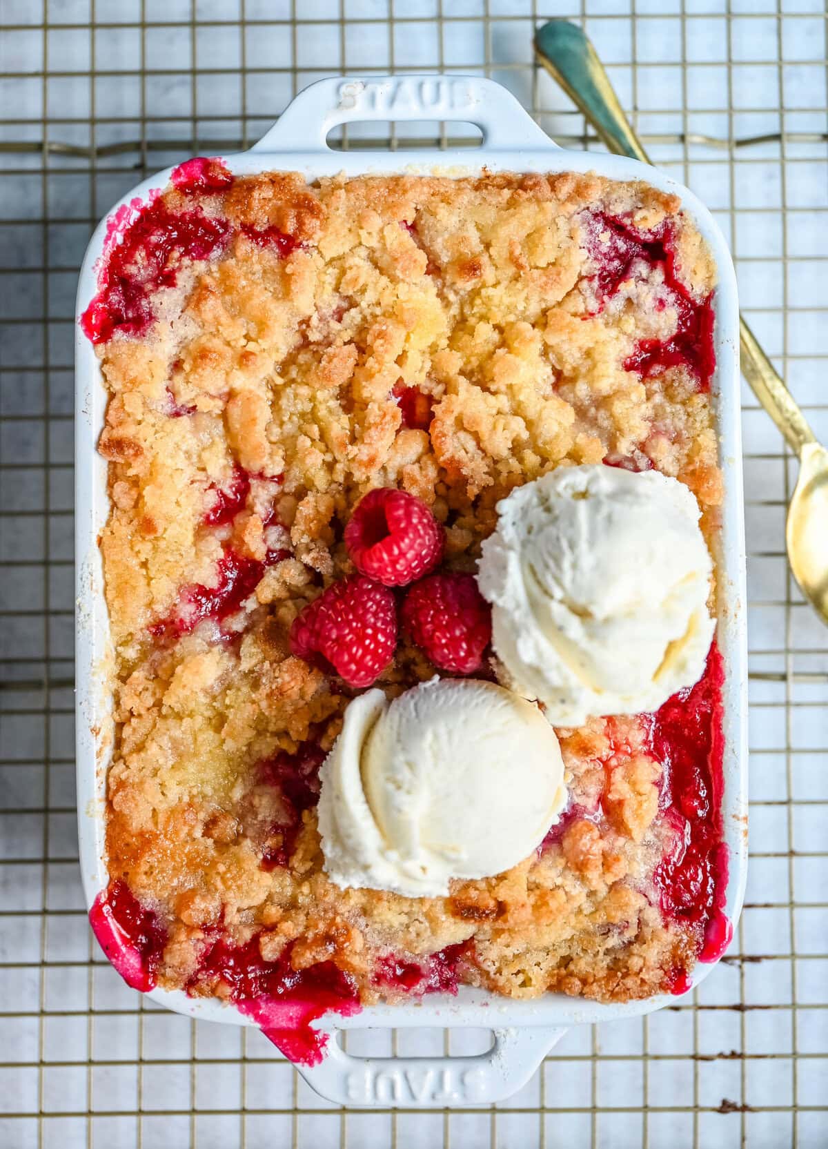This easy Raspberry Crisp is a summer dessert favorite made with sweet, juicy raspberries and a buttery golden crumble topping. It’s the perfect way to use fresh raspberries when they’re in season, serve it warm with a scoop of vanilla ice cream for a quick fruit dessert perfect for summer.