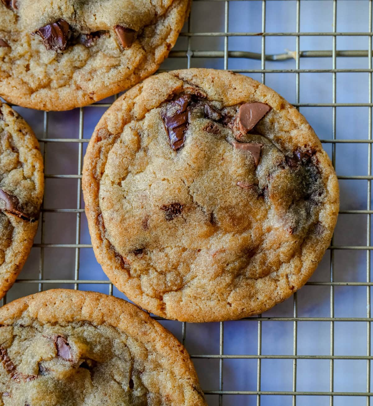 Are you team crispy or chewy? These thin and chewy chocolate chip cookies will win you over from the very first bite. Rich, buttery, and loaded with melty chocolate, these cookies are the perfect balance of crisp edges and soft, gooey centers. You are going to love these Thin and Chewy Chocolate Chip Cookies!