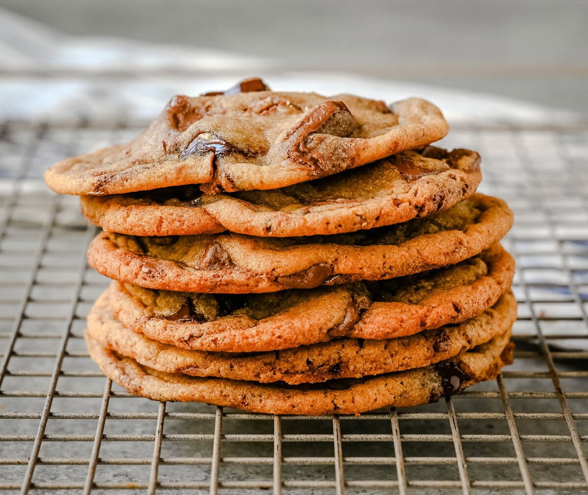 Thin and Chewy chocolate chip cookies stacked