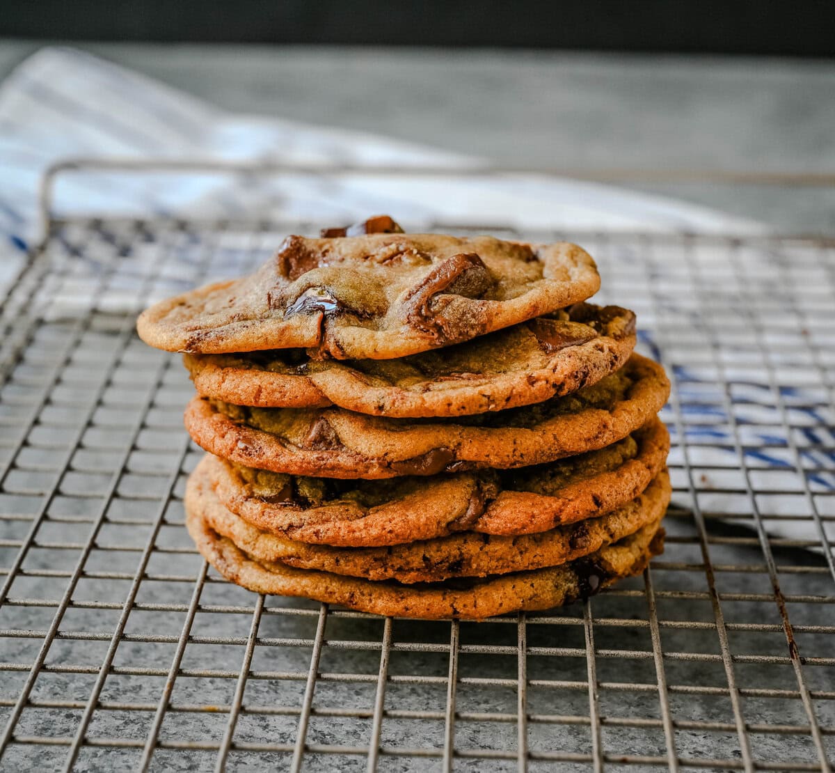 Are you team crispy or chewy? These thin and chewy chocolate chip cookies will win you over from the very first bite. Rich, buttery, and loaded with melty chocolate, these cookies are the perfect balance of crisp edges and soft, gooey centers. You are going to love these Thin and Chewy Chocolate Chip Cookies!