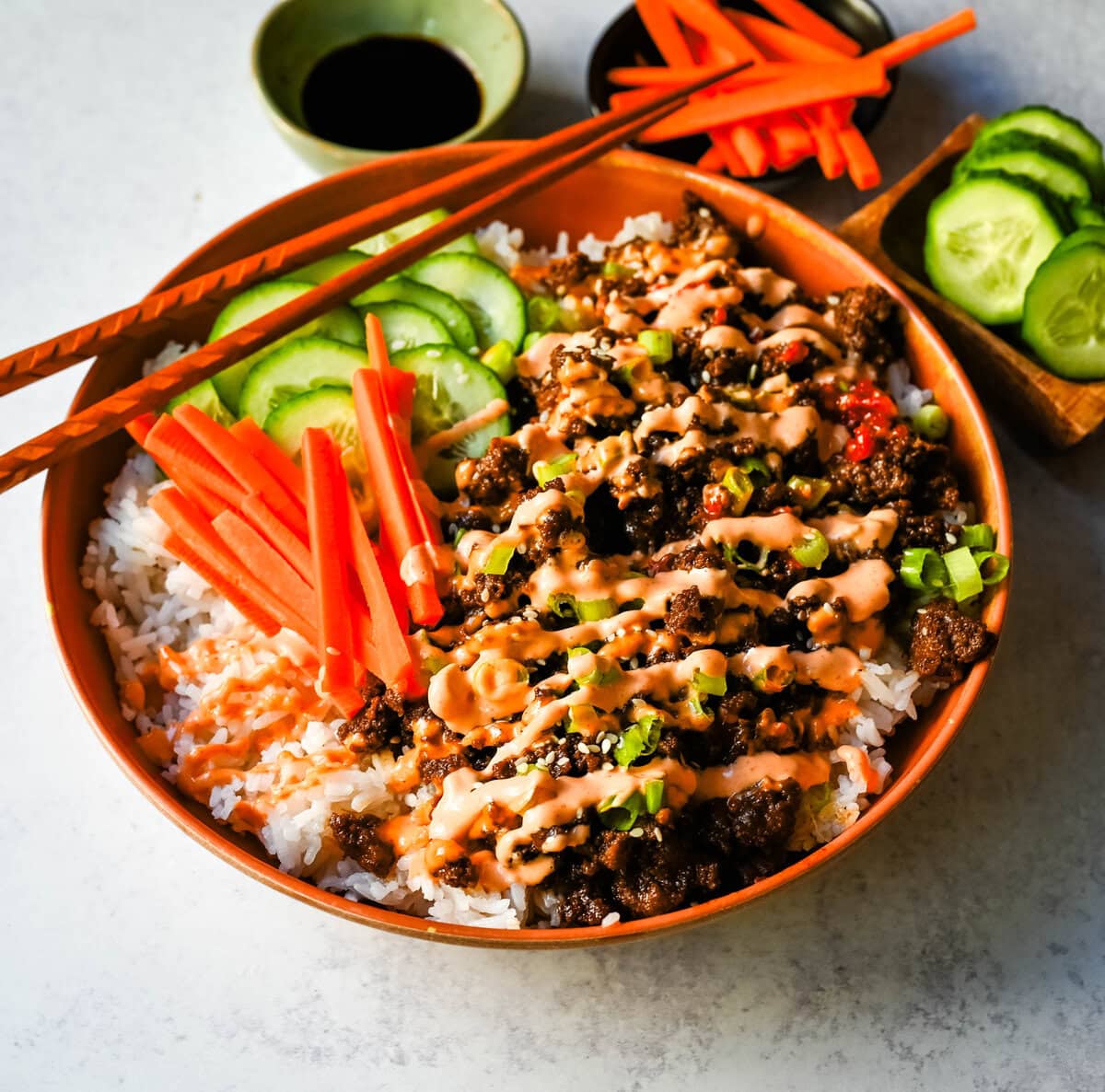 These Easy Korean Beef Bowls are a flavorful dinner that come together in just 20 minutes. Made with ground beef, garlic, ginger, soy sauce, sesame oil, and brown sugar or honey, all served over fluffy white rice.