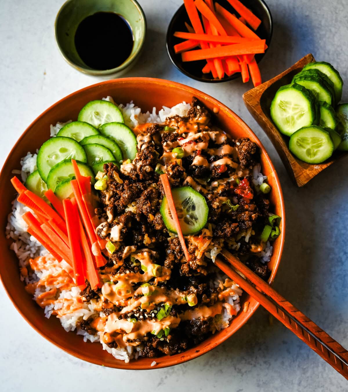 These Easy Korean Beef Bowls are a flavorful dinner that come together in just 20 minutes. Made with ground beef, garlic, ginger, soy sauce, sesame oil, and brown sugar or honey, all served over fluffy white rice.