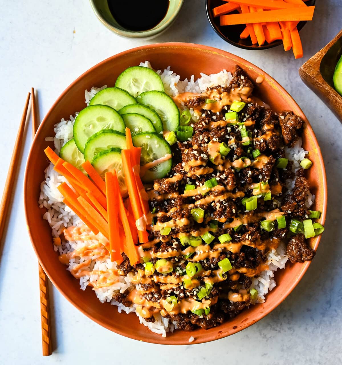 These Easy Korean Beef Bowls are a flavorful dinner that come together in just 20 minutes. Made with ground beef, garlic, ginger, soy sauce, sesame oil, and brown sugar or honey, all served over fluffy white rice.